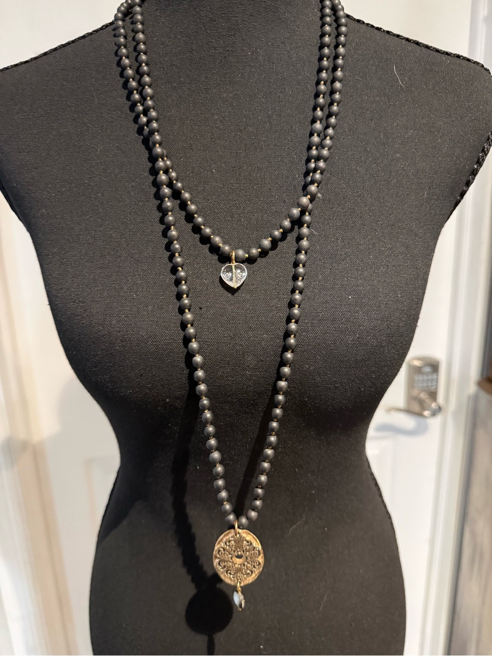 Katia Designs Black Beaded Necklace with Gold “Strong” Medallion and Heart Charm